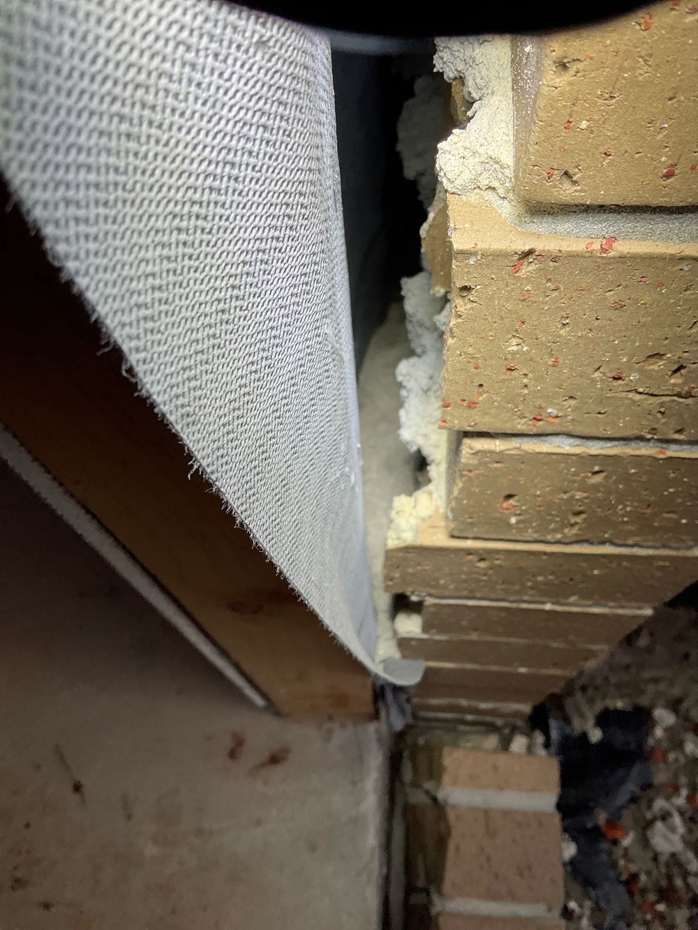 Mortar in the cavity and weep holes under paving: brick drainage in Strathtulloh