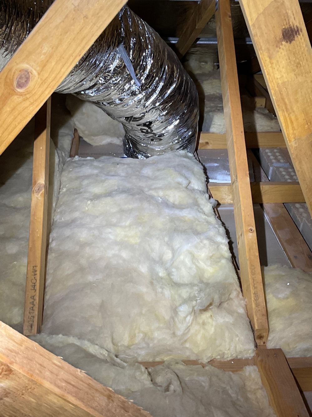 Ceiling batts pushed out of place, leaving bare patches above rooms, found during a pre-handover inspection in Strathtulloh